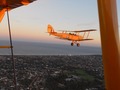 No 77 Squadron Association Interesting Shots photo gallery - DH82A VH-FAS ( DHA34) Tiger Moth, Flown by Mick Harcourt and Paul Falconer-West. Aircraft owned by the Royal Aero Club of Western Australia.   FAS was the former A17-37.  It was civilianized in July 1947 as VH-RJA for Ronald   J. Annetts of Melbourne, operating under the snappy name of Hire or Fly Yourself And Air Services Pty Ltd at Essendon.   In 1949, it went to Furness Aviation of Parafield, SA, who re-registered it for their initials as VH-FAS.  It was purchased in 1959 by Superspread Pty Ltd of Moorabbin.   After its crop spraying days were done, it was acquired by the Royal  Aero Club of WA at Jandakot as kind of a nostalgia machine, and re-painted as a warbird. DH82A VH-BTP(A17-744)( MSN DHA1075/T315)    Tiger Moth, Owner Clark Rees and passenger Helen Tomkinson.  Boeing  VH URC Stearman.  Owner Rod Edwards and passenger was his wife Anita Edwards.